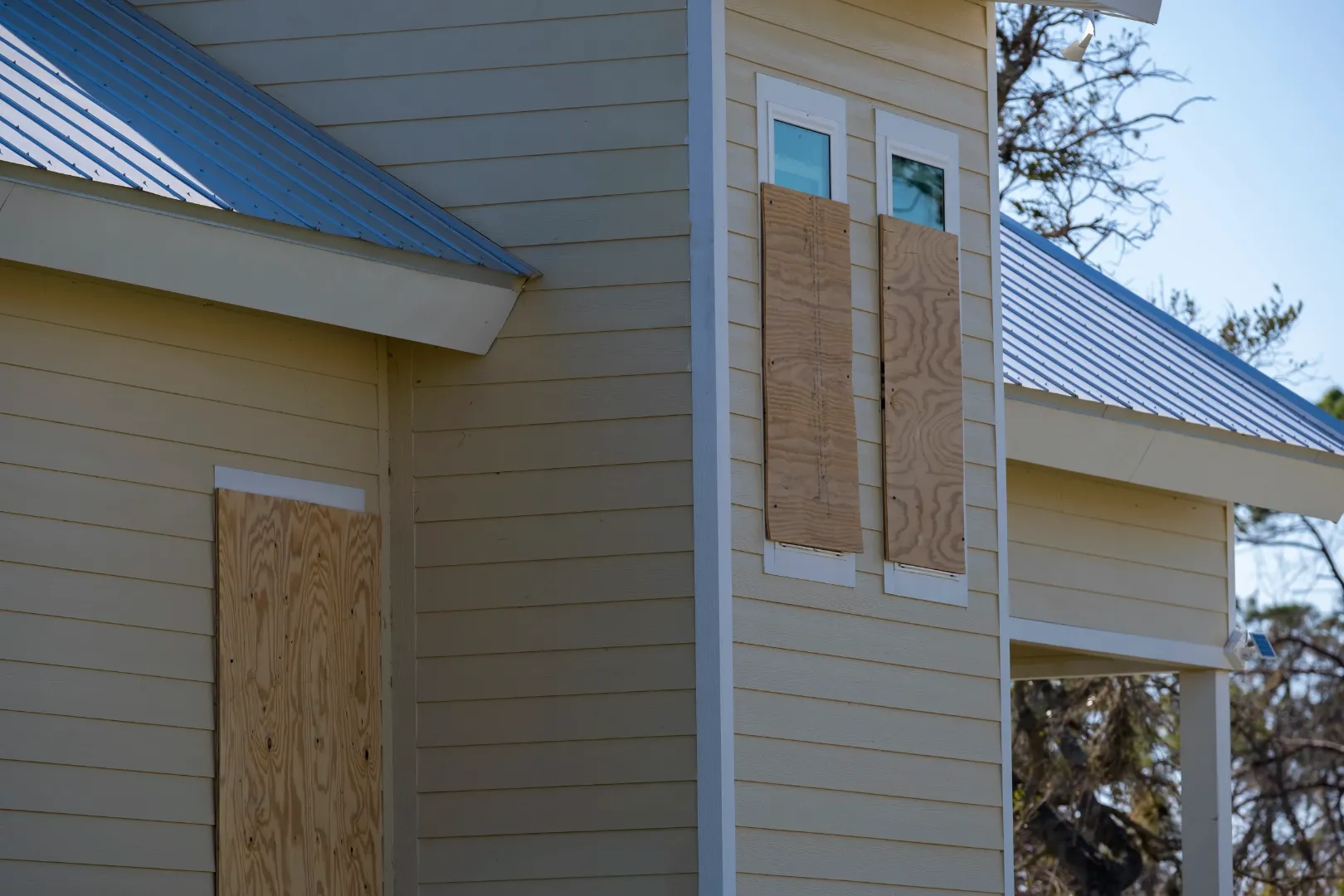 Home exterior featuring gray fiber cement siding with white trim