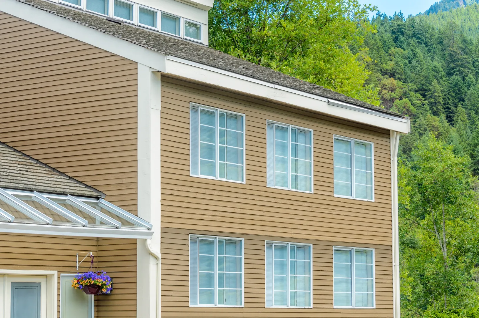 Residential home with brown composite siding that creates the appearance of natural wood.